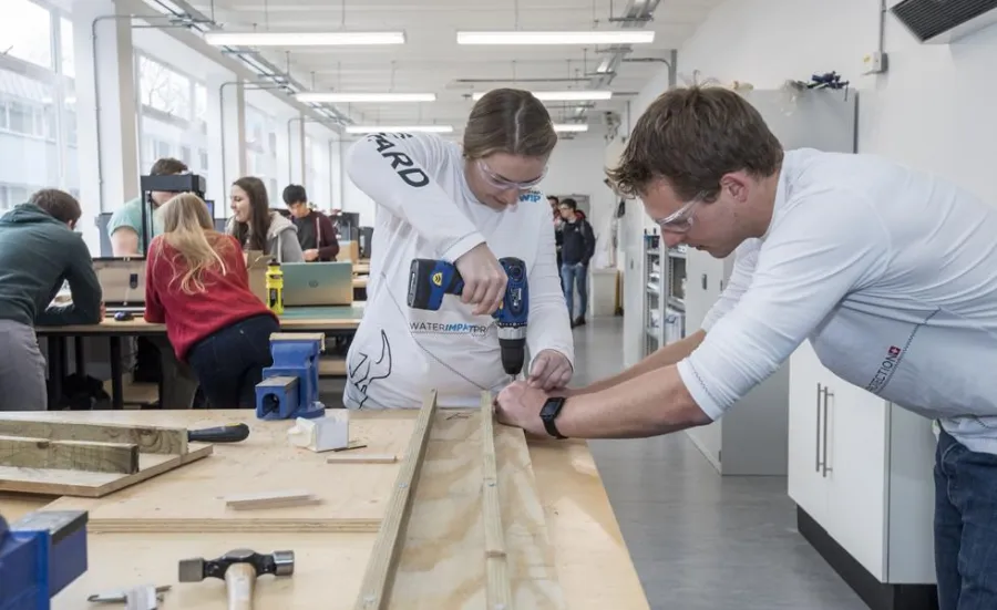 Students work on a project in a design studio