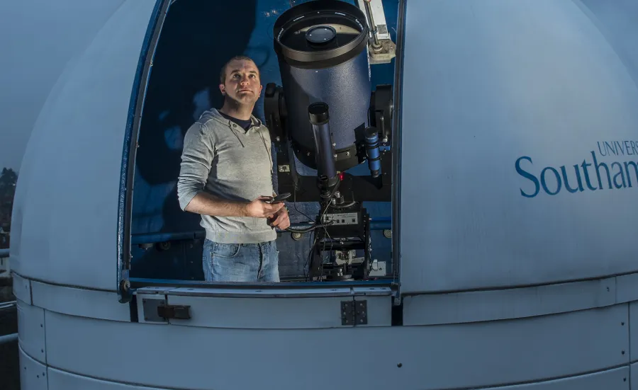 Researcher using a rooftop observatory