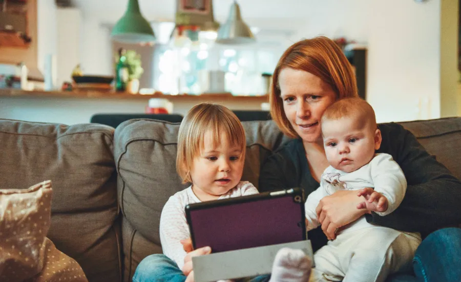 Mum with children using a tablet