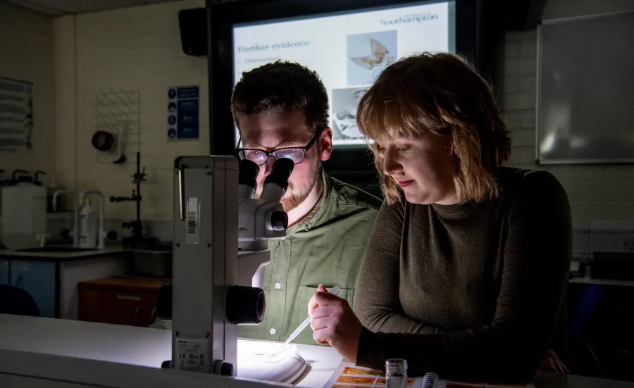 image of students using microscopes