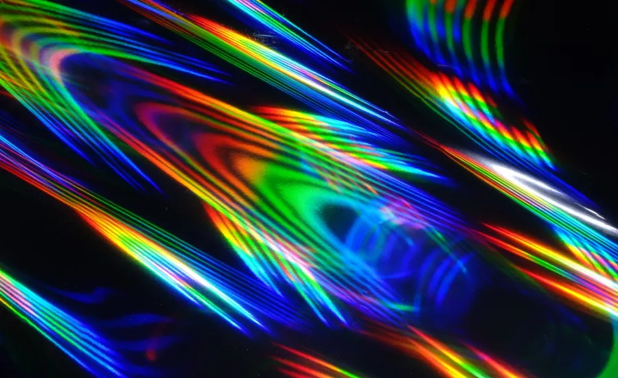 Holographic patterns of light against a black background