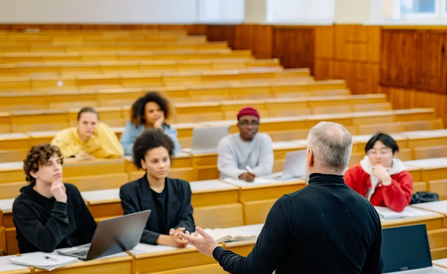 Lecturer and students in a lecture theatre