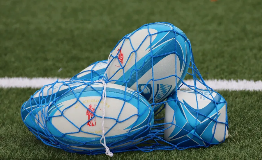 Rugby balls in a carrying net