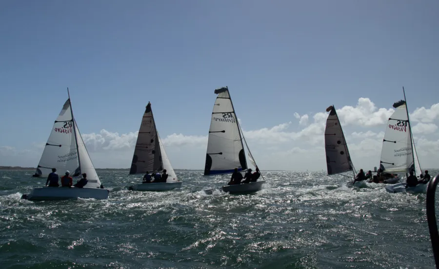 5 dinghies sailing on choppy sea