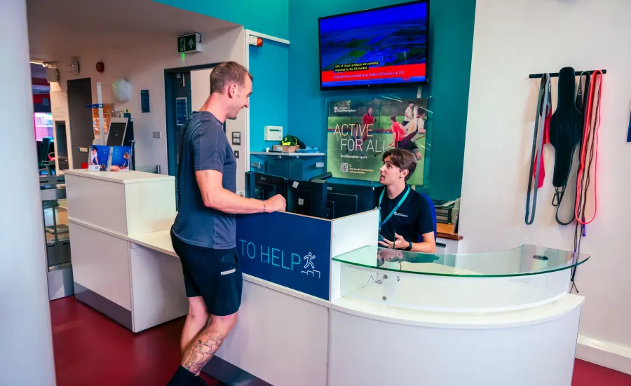 A customer talking with the receptionist at the Jubilee sports centre reception desk