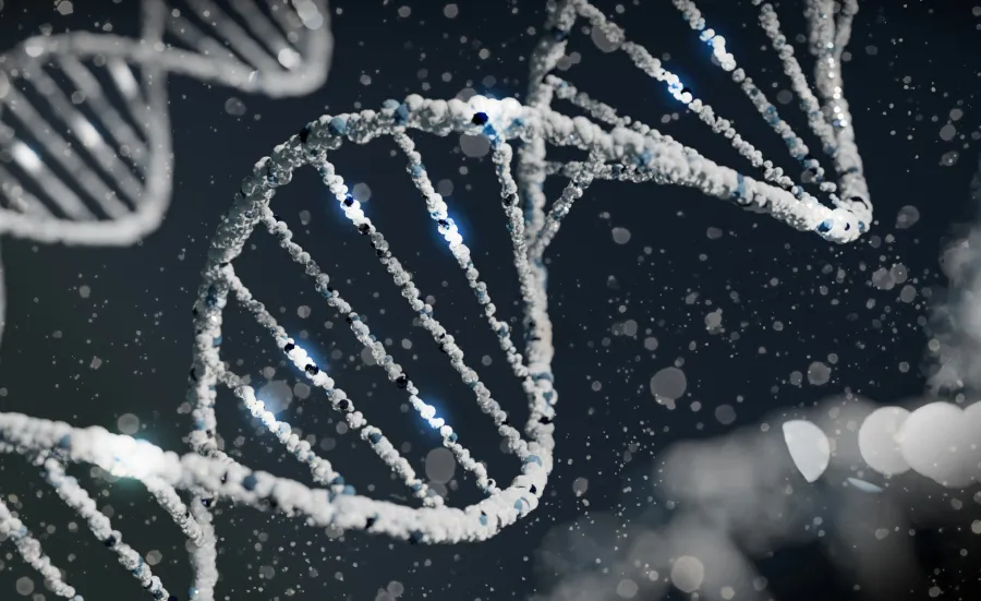 A digitally rendered close-up of a DNA double helix structure with spherical particles against a dark background with bokeh light effects