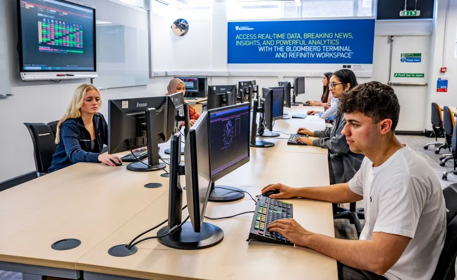 Students in the Financial Laboratory facility