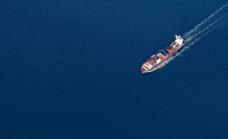 A cargo ship sailing on the ocean