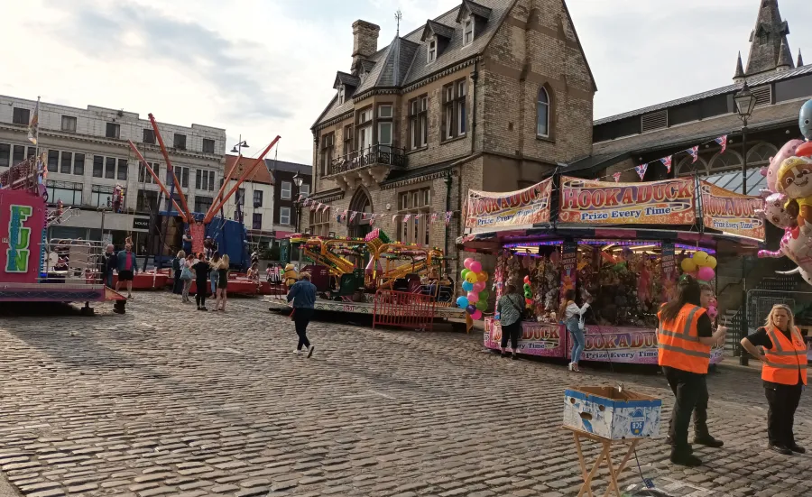 Wide shot of a market in a town centre