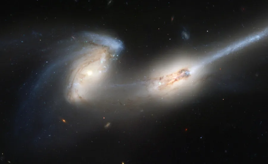 A satellite image of two galaxies colliding with each other.