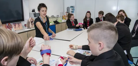 Teaching explaining part of a health lesson to school pupils