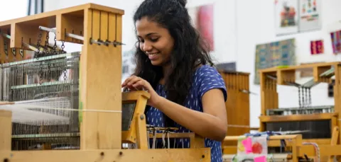 A student using a loom.