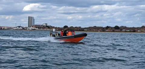 Powerboat with instructor and student out on the water