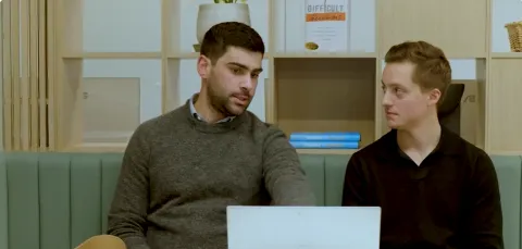 Two members of a knowledge transfer partnership team discuss the project