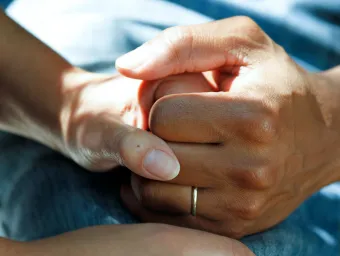 Unsplash image of a couple's clasped hands