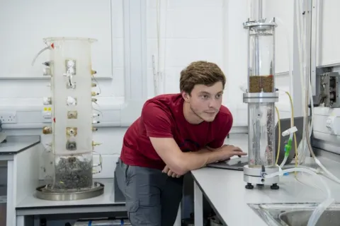 A student at work in the geomechanics laboratory