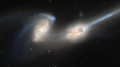 A satellite image of two galaxies colliding with each other.