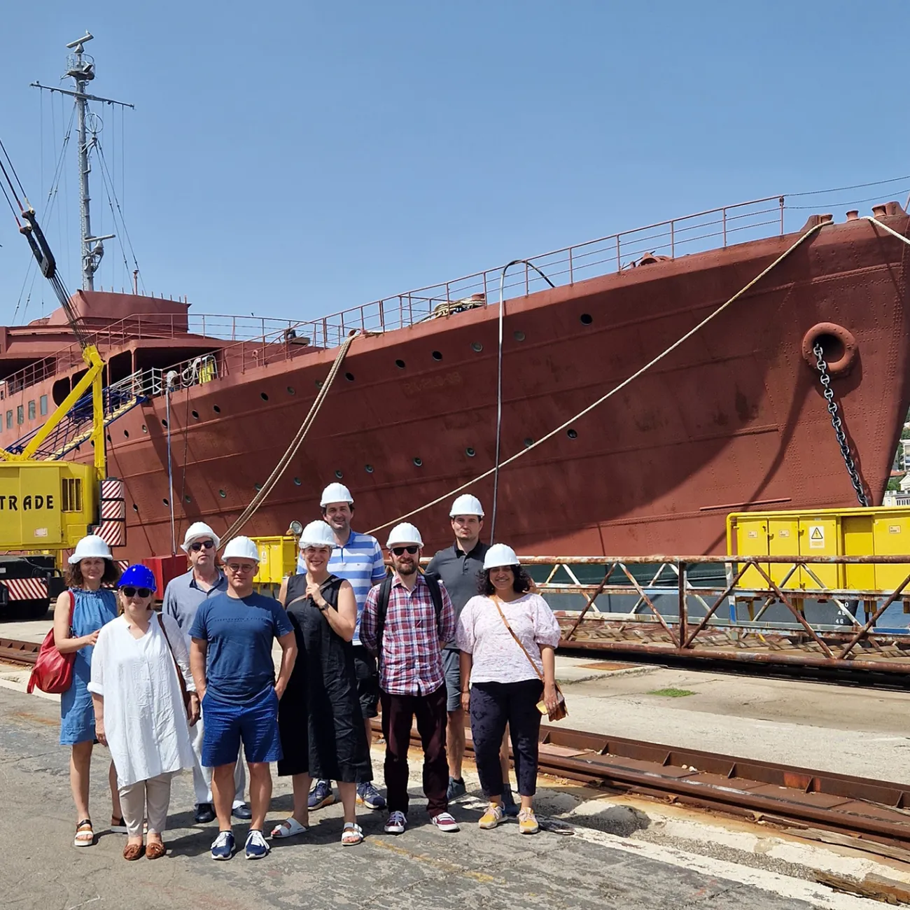 Working group members by the former Yugoslav state ship Galeb, in Croatia