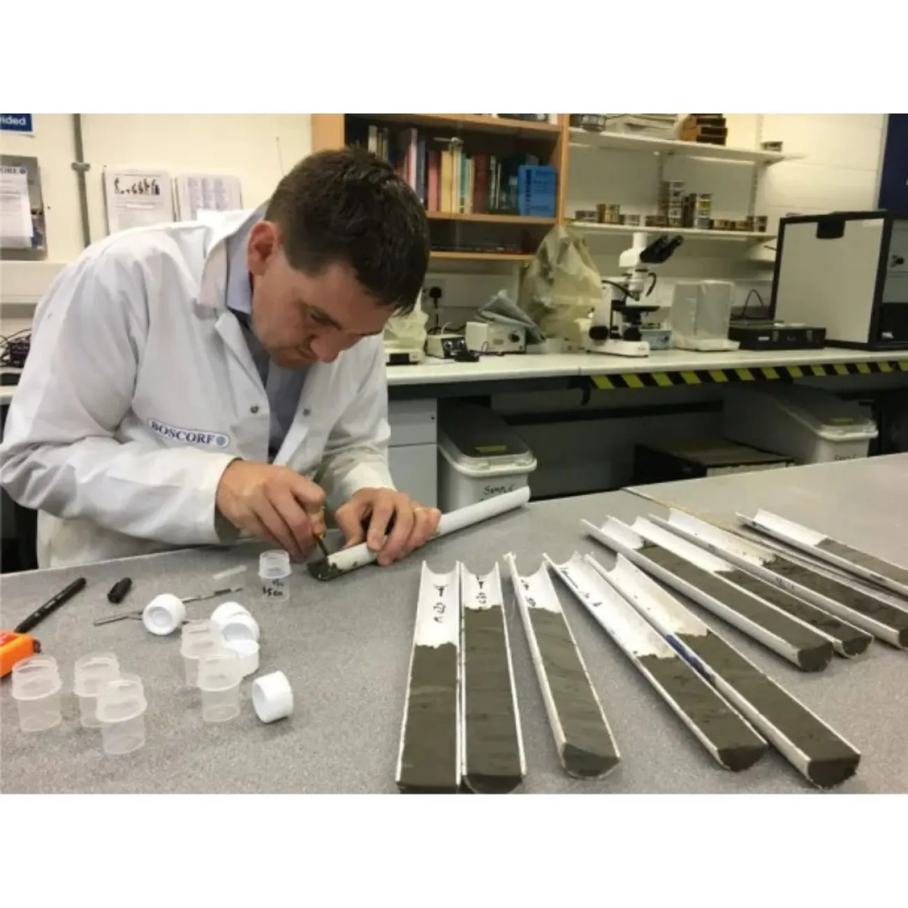 A man taking some pollen sampling from deposit cores