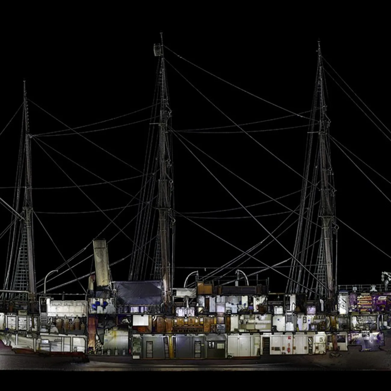 A digitally rendered cross-section of the RRS Discovery showing the different levels and holds of the ships interior