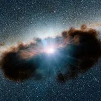 A growing supermassive black hole, one of the most obscured known, meaning it is surrounded by extremely thick clouds of gas and dust