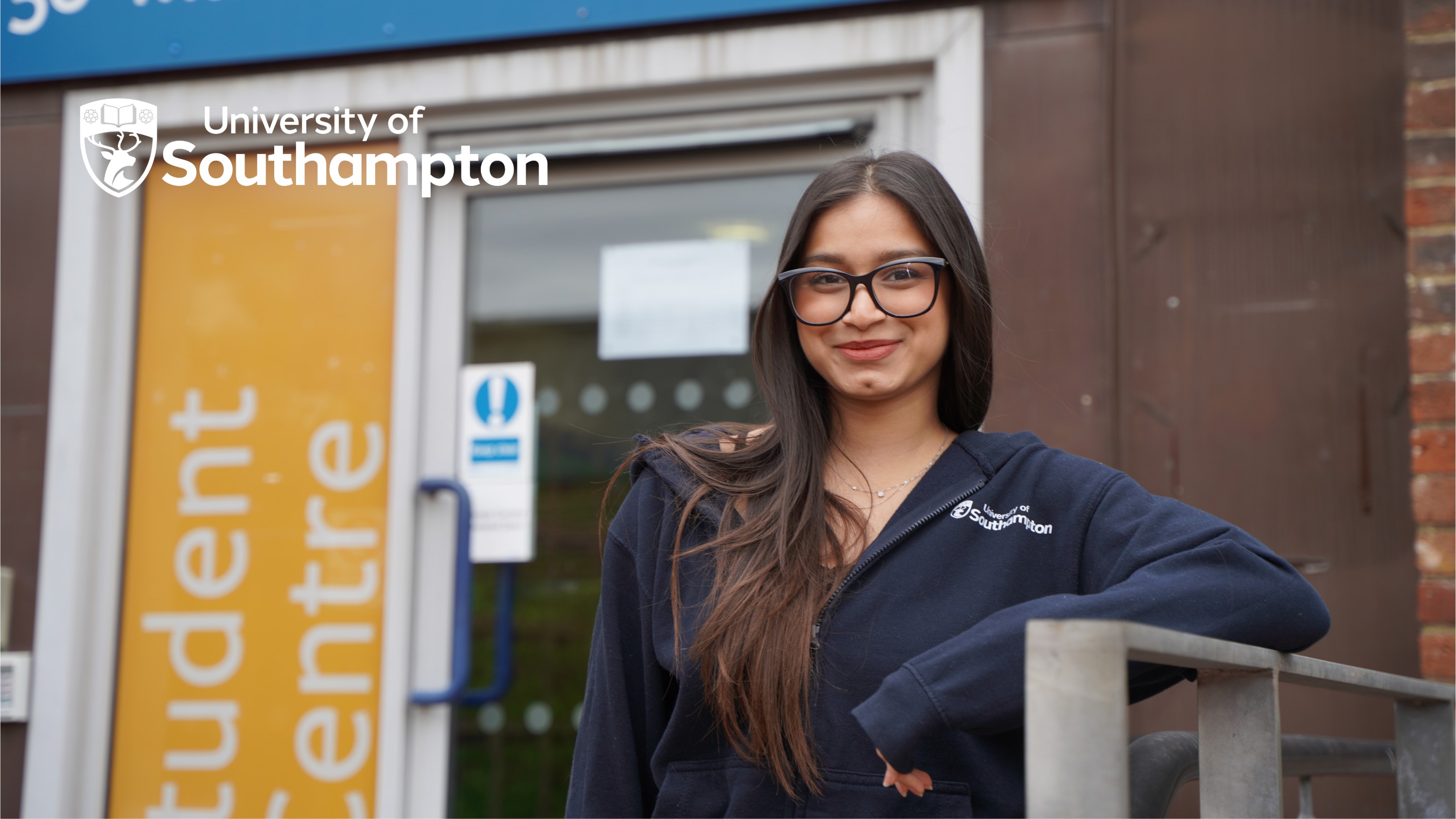 A maths student smiling outside the maths study centre
